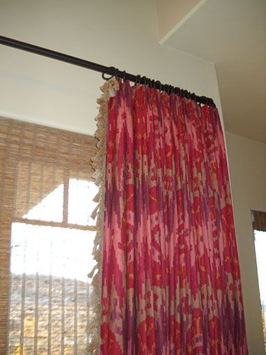 sandy drapes, seat cushions, striped, tan trending pillows and fabrics. vignettes close up view, bright pillows